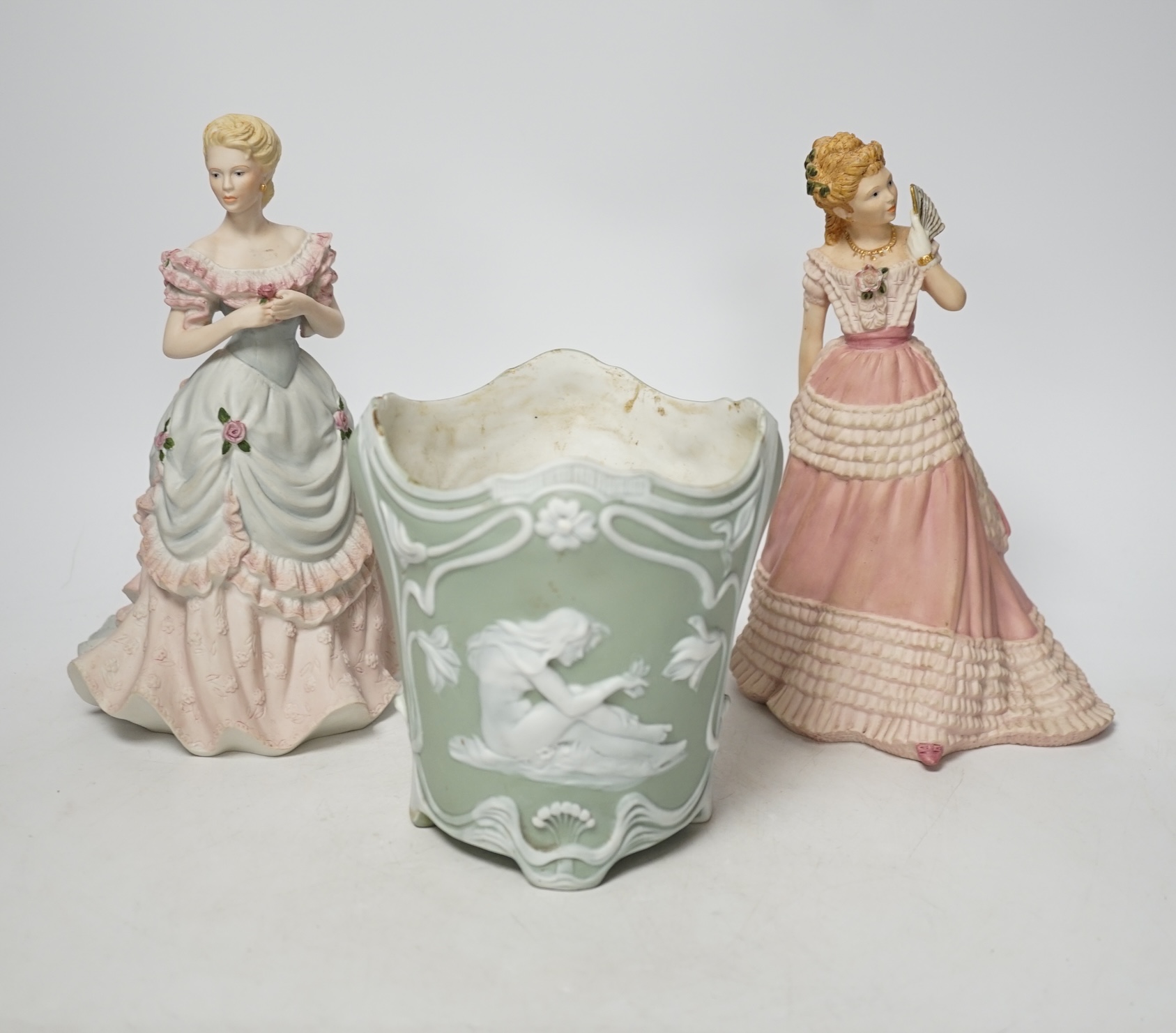 A bisque planter and a pair of Coalport figures, figures 21cm high